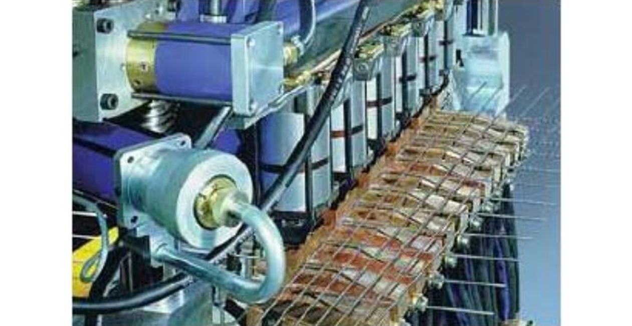 Close-up view of CNC welding head and electrode system during industrial operation