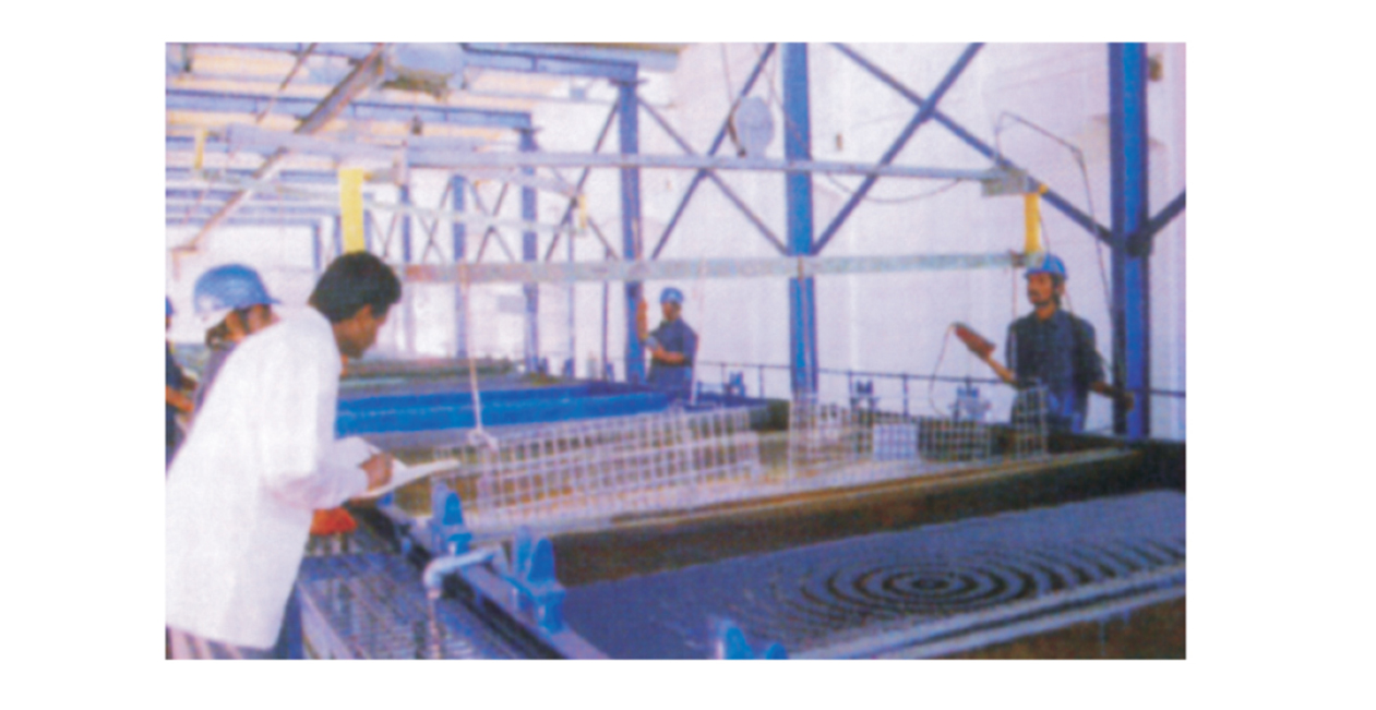 21-tank zinc plating process with operators monitoring metal surface treatment